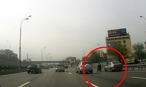 Idiot Driver Brushes against Biker, Lucky Rider Remains Upright
