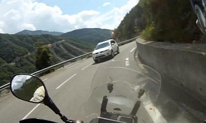 Idiot Driver Fails to Keep His Lane, Almost Hits Motorcyclist