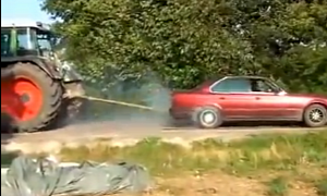 Idiot Ruins BMW Playing Tug of War with a Tractor