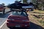 If It Fits, It Ships: Toyota Corolla Hauls Snowmobile on the Roof