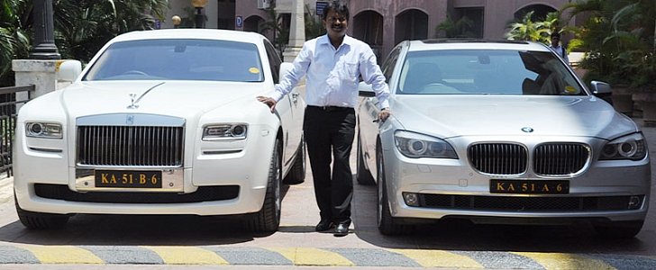 Ramesh Babu with two of his luxury cars