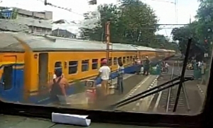 Indonesian Rider Couldn't Care Less for the Incoming Train