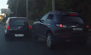 Infiniti SUV Almost Mounts Small Car, Runs From Accident Scene