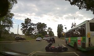 Is It the Shockwave of Two Cars Crashing That Sends This Biker to the Ground?