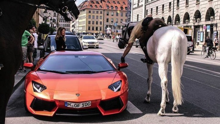 Cop on a horse and Lamborghini Aventador