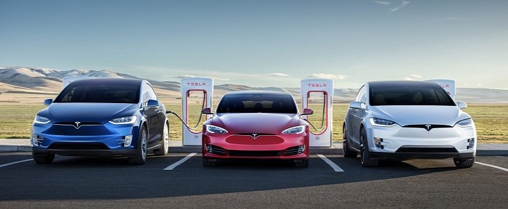 Teslas charging at Supercharger station