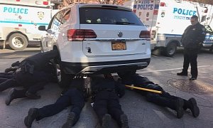 It Took 7 Cops And a Car Jack to Rescue a Kitty From Under a Volkswagen Atlas