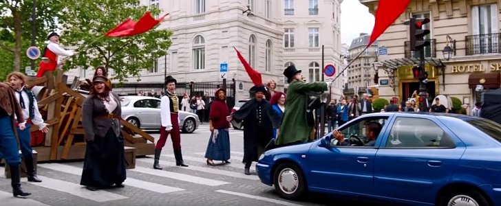 James Corden jumps on car during Crosswalk the Musical in Paris