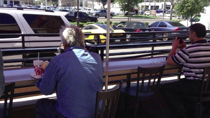 Jay Leno having his lunch at a local fast food next to his parked McLaren P1