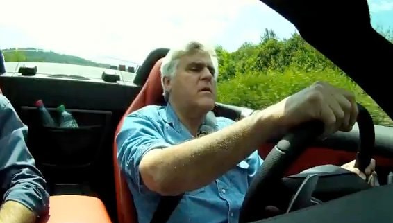 Jay Leno tastes a piece of the open-top Gullwing