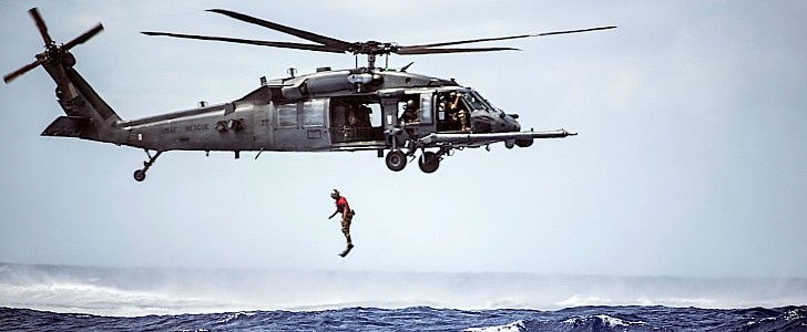 Pararescueman jumping out of a HH-60G Pave Hawk