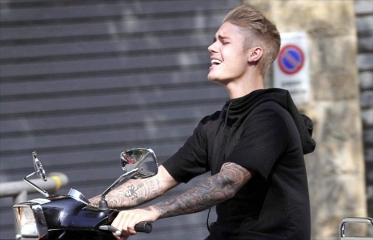 Justin Bieber rides a Vespa