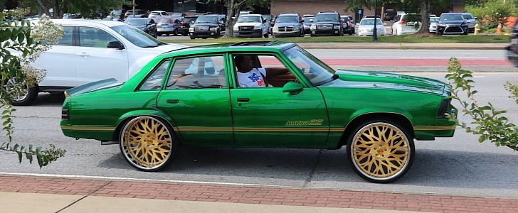 Chevrolet Malibu four-door is Kandy Green and riding on gold 24s