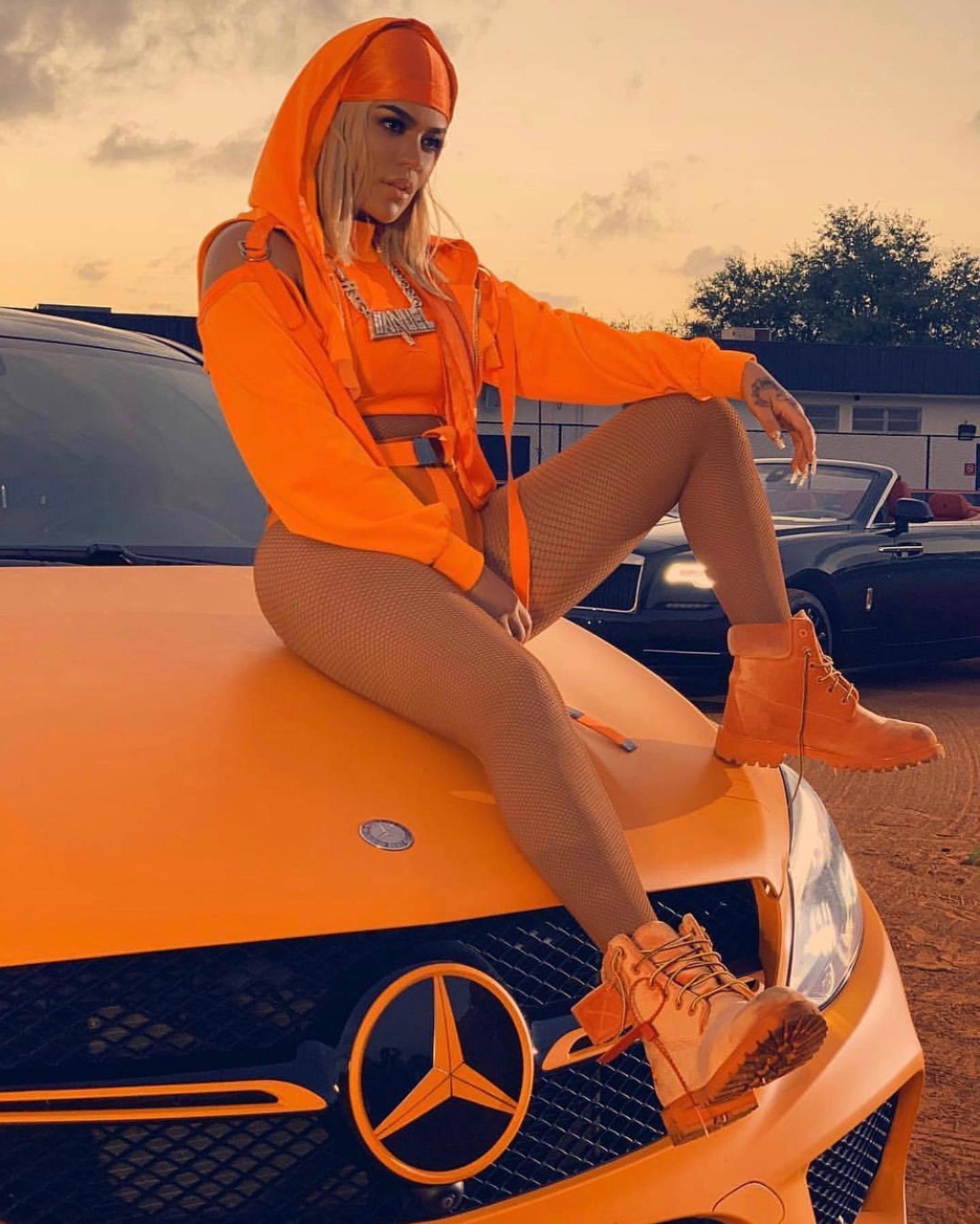 KAROL G Sure Knows How to Match Outfits With Wrapped Luxury SUVs and  Supercars - autoevolution