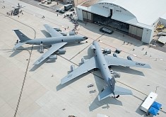 KC-135 Stratotankers Almost Kiss Each Other, Surrounded by Tiny Humans