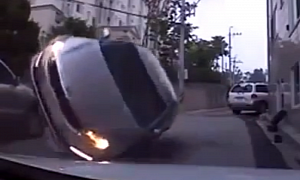 Kia Flips Over After Crashing into Parked SUV