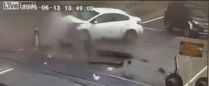 Kia Violently Smashes into Train Barrier in Russia, SUV Narrowly Avoids Being Hit 