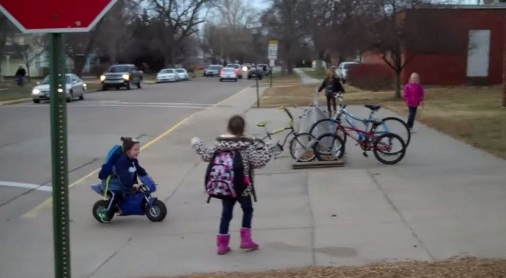 Kid riding electric pocket bike to kindergarten