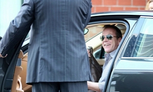 Kiefer Sutherland Sports a Big Smile in His Porsche Panamera