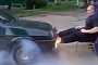 Leg Day in Russia: Pushing Against a Car Doing a Burnout