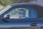 Lindsay Lohan Smokes While Driving a Porsche