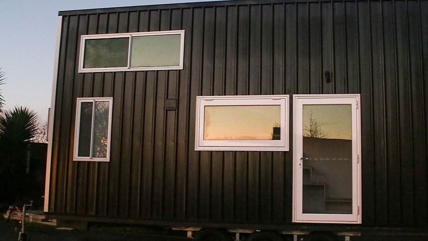 Little Boho is a dual-loft tiny house with clever storage and a super cozy ambiance