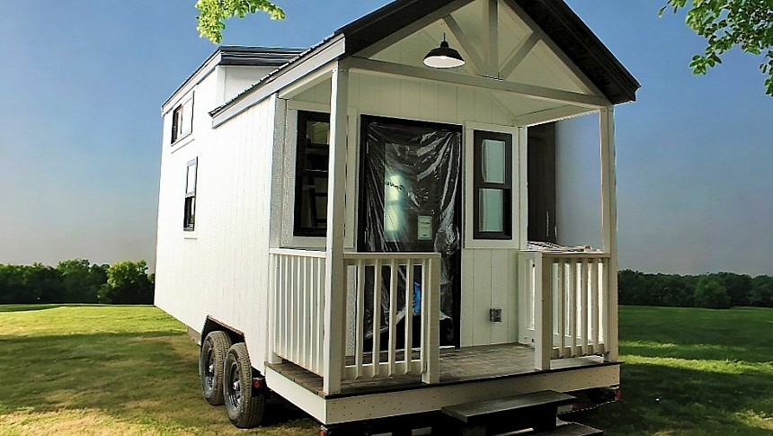 The Pinnacle is one-loft tiny house with a traditional porch