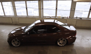 Low Lexus IS Sitting High in Tall Building Garage
