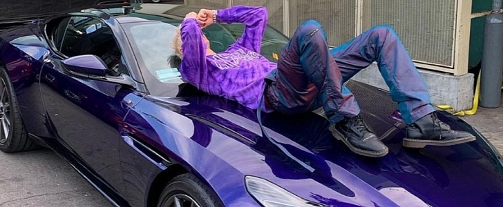 Machine Gun Kelly shows off his end-of-tour treat to himself, a purple Aston Martin DB11