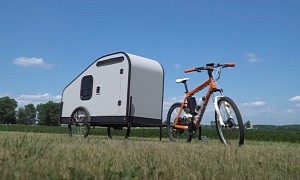 Man Electrifies His Bicycle, Uses It To Pull His Epic DIY Camper Trailer