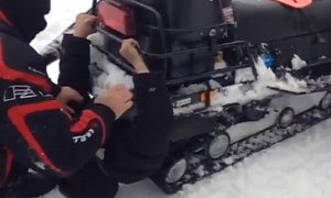 Man Gets "Eaten" by a Snowmobile Track in Russia