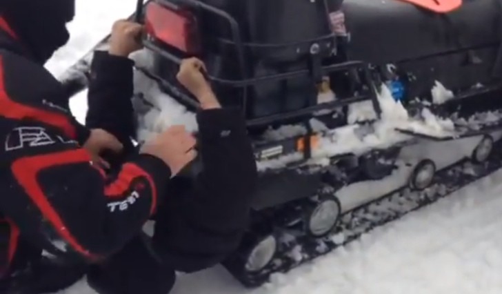 Man Gets "Eaten" by a Snowmobile Track in Russia