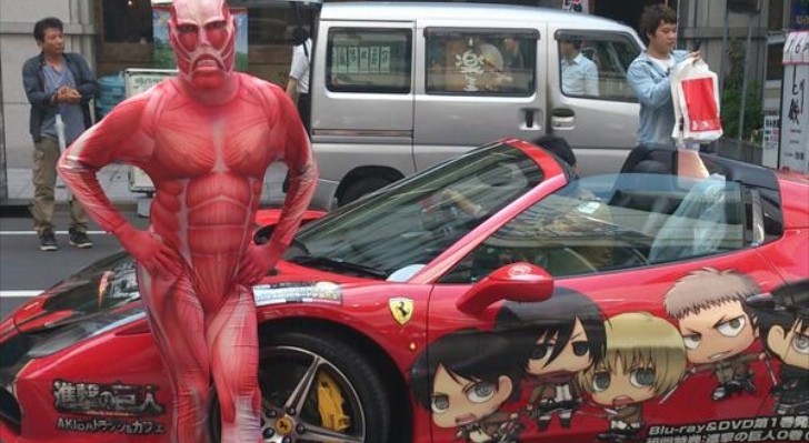 Man in Monster Spandex Costume Poses Next to Ferrari in Japan