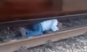 Man Lies on The Tracks to Avoid Being Hit by Train, Cheats Death