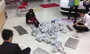 Man Pays for New Truck in 85,000 One-Yuan Coins
