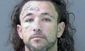 Man With Face Tattoo Impersonates Cop, Steals Car And Spray Paints it Purple