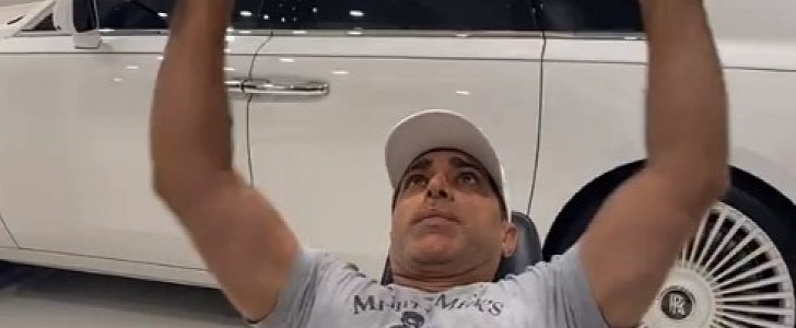 Manny Khoshbin works out in the garage next to his Rolls-Royce cars