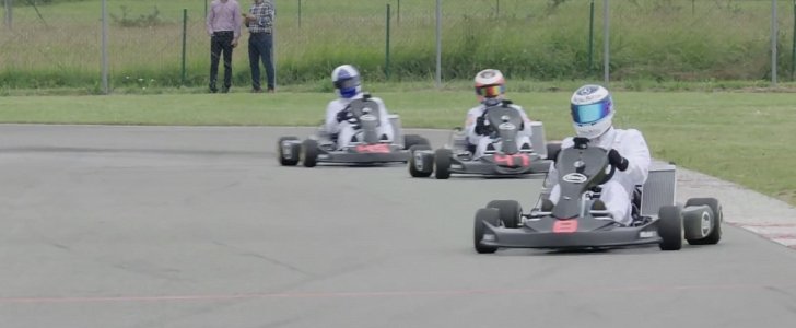 McLaren Formula One Champions drive go-karts on track