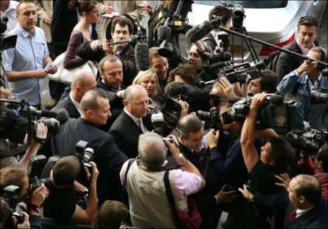 McLaren's CEO Ron Dennis surrounded by journalists