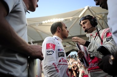 Lewis Hamilton and crew members from McLaren