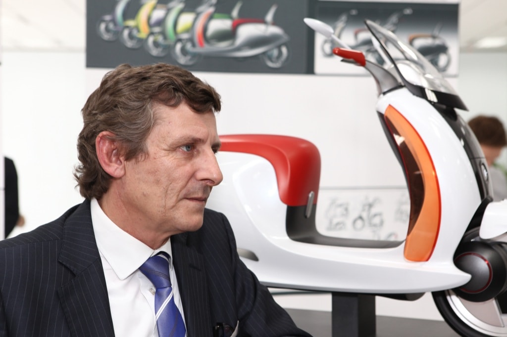Olivier Boulay in front of a smart escooter concept model