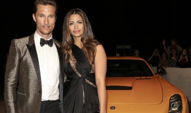 Matthew McConaughey and Camila Alves in Front of a Mercedes-Benz SLS AMG Black Series 