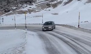 Mitsubishi Lancer Evo Drifting on Snowy Mountain Road Doesn't Even Try