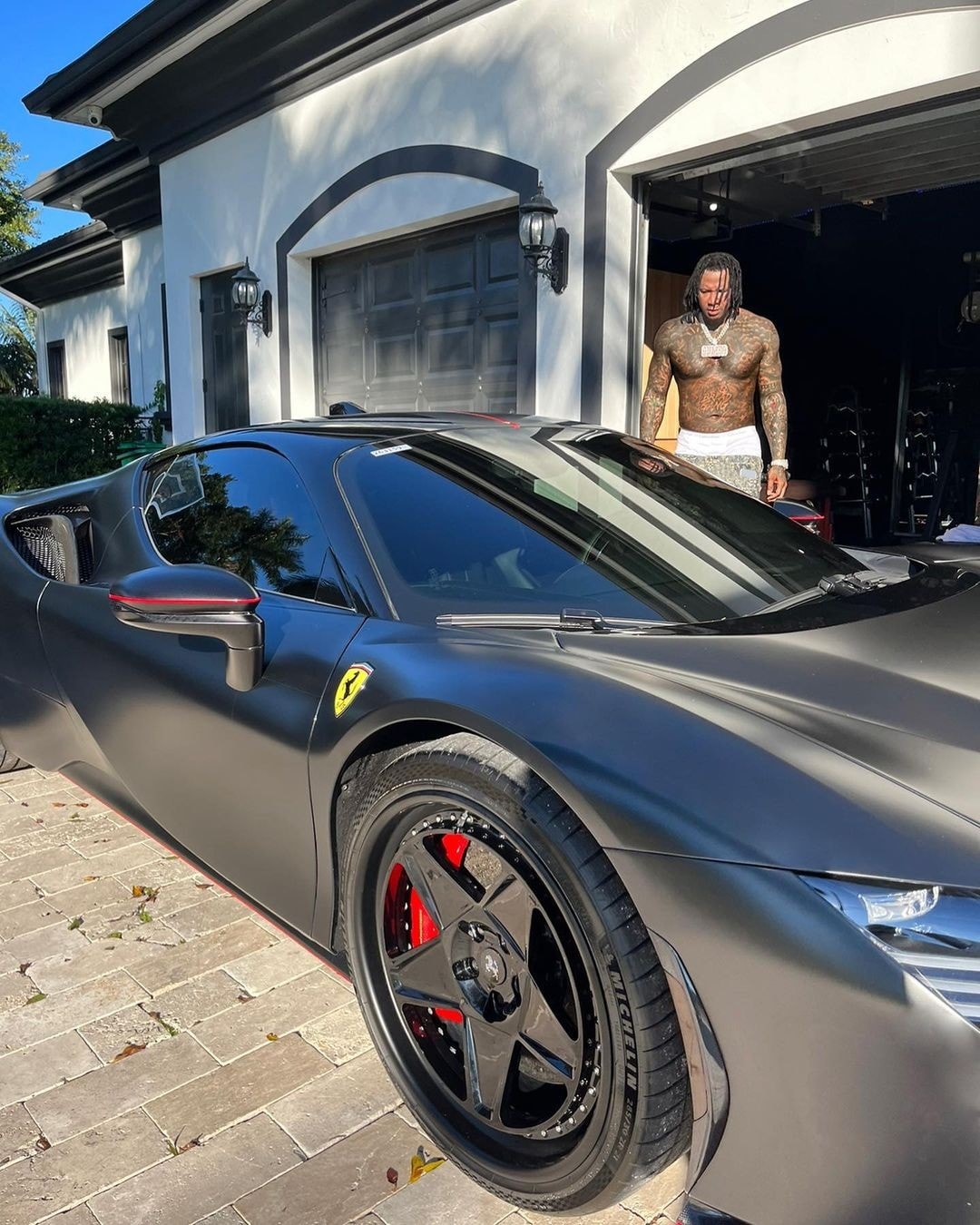 Moneybagg Yo with his $650,000 Ferrari SF90 🏎💨 📲 Find Moneybagg Yo  outfits in @whatsonthestar.app