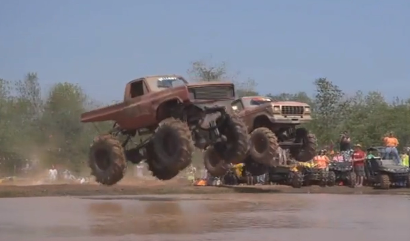 Monster Trucks Jumping into Mud: Louisiana Mudfest.