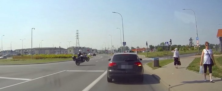 Polish motorcycle cop pulling a perfect wheelie