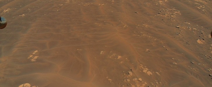 NASA’s Ingenuity helicopter snapped pictures of these sand dunes and rocks during its ninth flight, on July 5th