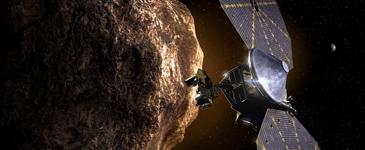 An illustration of the Lucy spacecraft near a Trojan asteroid
