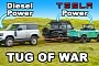New Defender Fights Tesla-Powered Old Defender in Epic Tug-of-War, Big Brother Shows Up