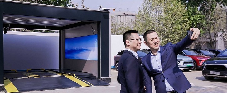William Li Takes a Selfie in Front of a NIO Battery Swap Station